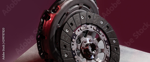 Spare part - clutch plate against maroon background