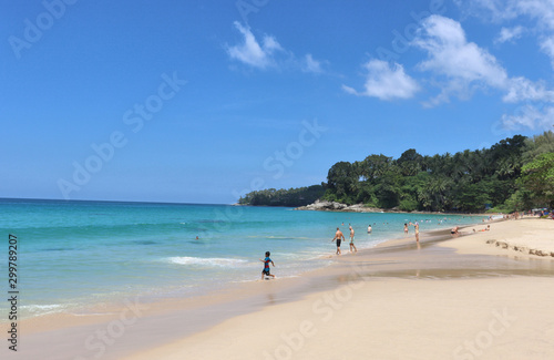 Fototapeta Naklejka Na Ścianę i Meble -  view of patong beach in phuket, sea waves roll on the sandy shore, foam and spray of water