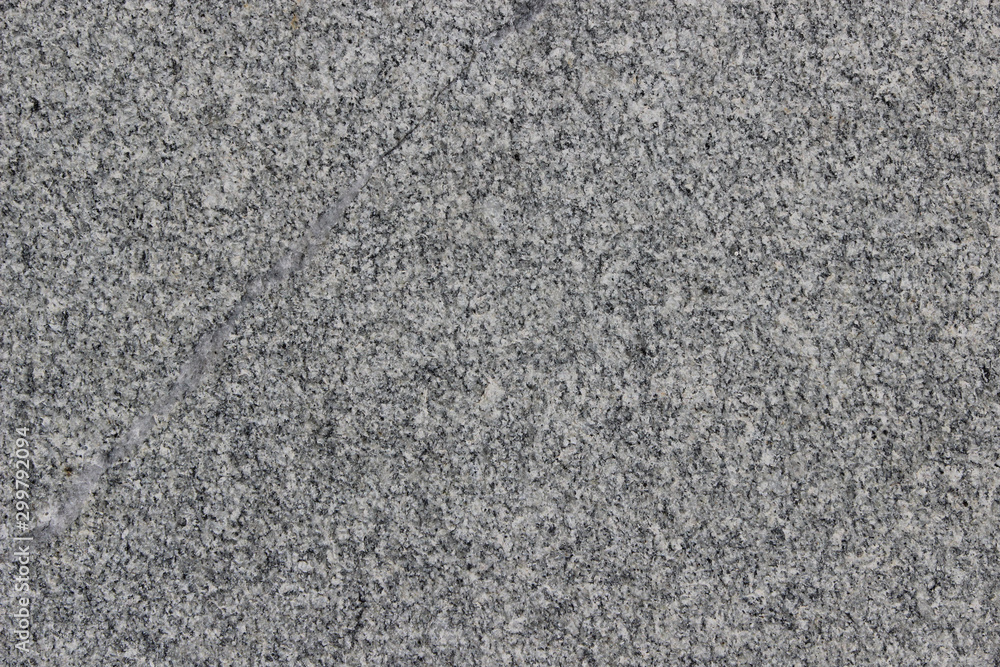Texture of a granite wall with a sealed crack Texture of a granite wall with a sealed crack
