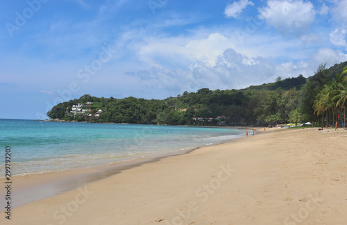view of patong beach in phuket, sea waves roll on the sandy shore, foam and spray of water
