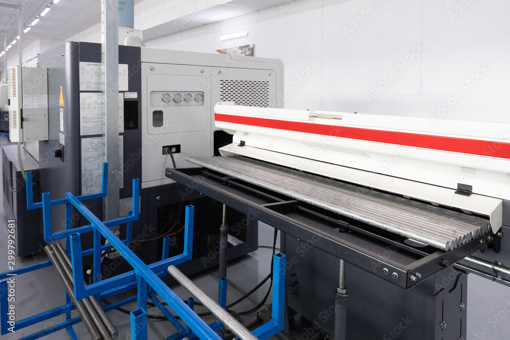an interior shot of producing line of metal parts in modern plant an interior shot of producing line of metal parts in modern plant
