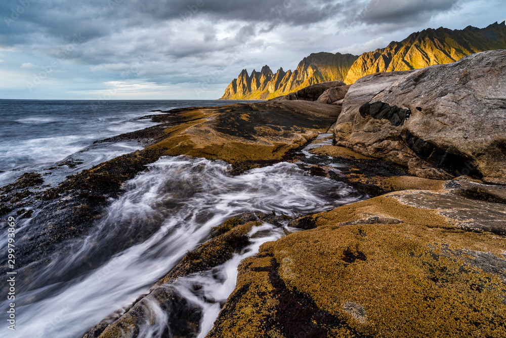 Rock formations and evening light on Devil's Teeth Mountains, Tungeneset, Senja, Norway. Rock formations and evening light on Devil's Teeth Mountains, Tungeneset, Senja, Norway.