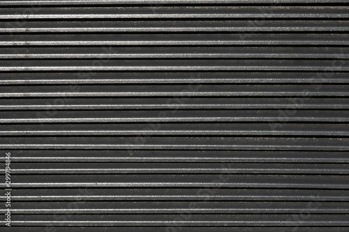Flatlay of ribbed metal surface for the blind