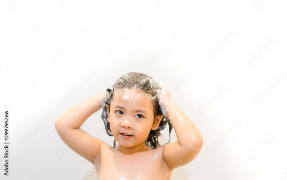 Little 4 years old asian girl in shower washing hair with shampoo. Little 4 years old asian girl in shower washing hair with shampoo.