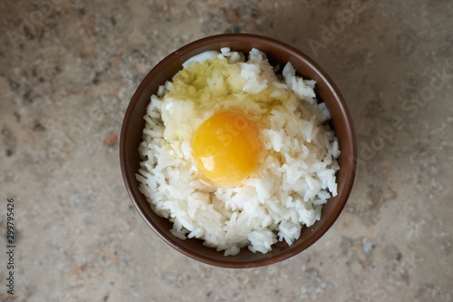 Принти на полотні Tamago kake gohan with raw egg in bowl, view from above