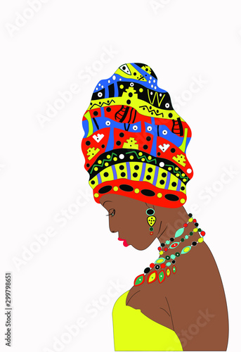 Girl  with dark skin with a turban on the head  (profile view).The girl tilted her head. Young girl pensive and modest 