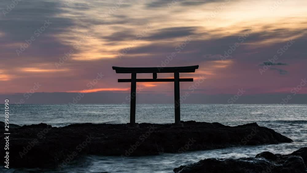 Timelapse Long Shot of Sunrise over Sacred Shinto Torii Gate by Sea in Japan Timelapse Long Shot of Sunrise over Sacred Shinto Torii Gate by Sea in Japan