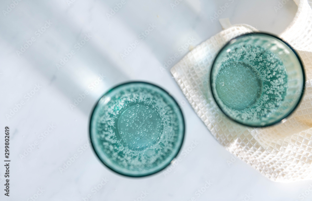 Sparkling Mineral Water in Clear Glasses Sparkling Mineral Water in Clear Glasses