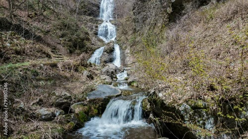 Timelapse Pan/Tilt Shot of Spring Waterfalls in Valley in Japan photo