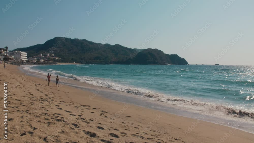 Children walking on beautiful sandy tropical beach. Children walking on beautiful sandy tropical beach.