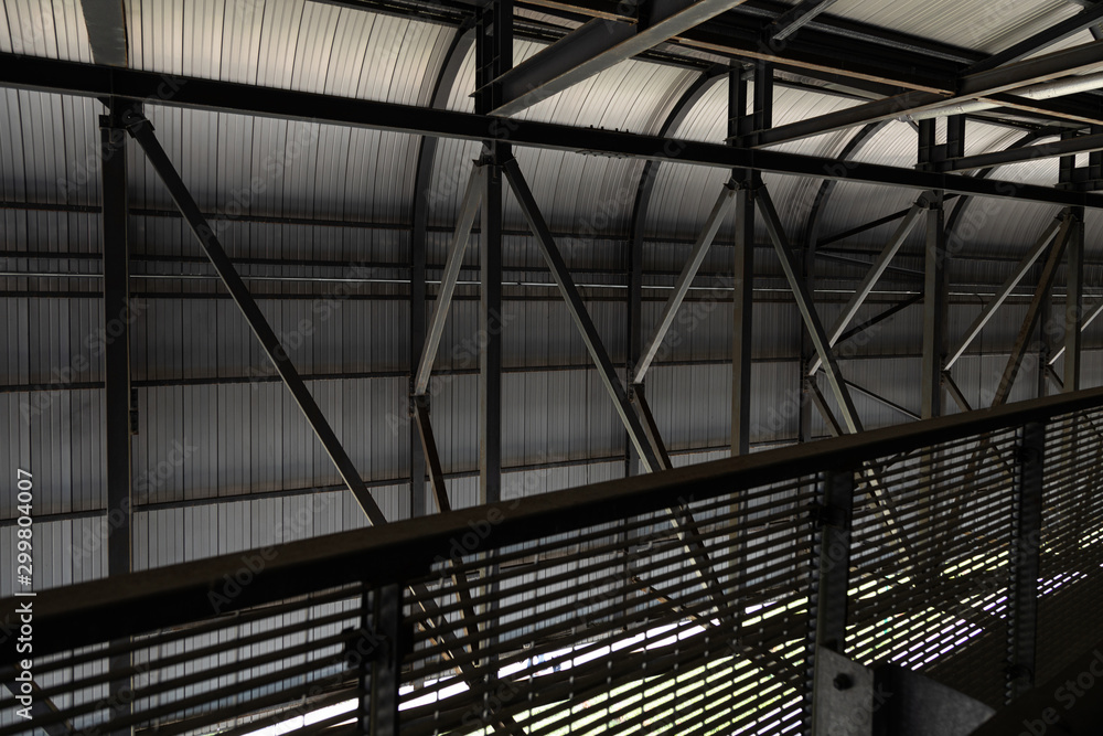 Metal construction of dark colors with beams and railing Metal construction of dark colors with beams and railing