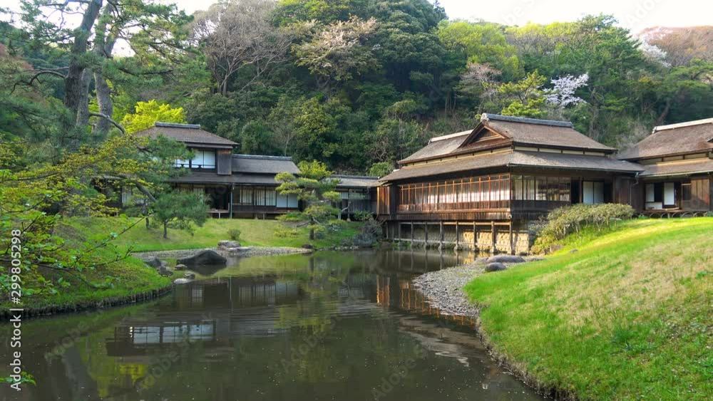 Static Shot of Traditional Tea House by Pond at Japanese Garden in Japan Static Shot of Traditional Tea House by Pond at Japanese Garden in Japan