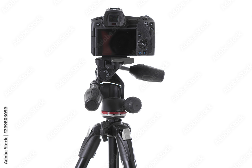 Backside view of modern multifunctional black camera on trepied isolated  Stock Photo | Adobe Stock