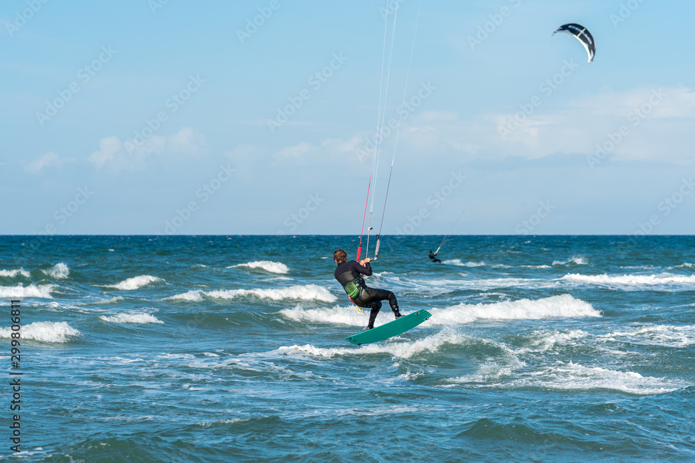 Kiteboarder in the Baltic Sea at the beach of Flügge on the island of Fehmarn in the north of Germany