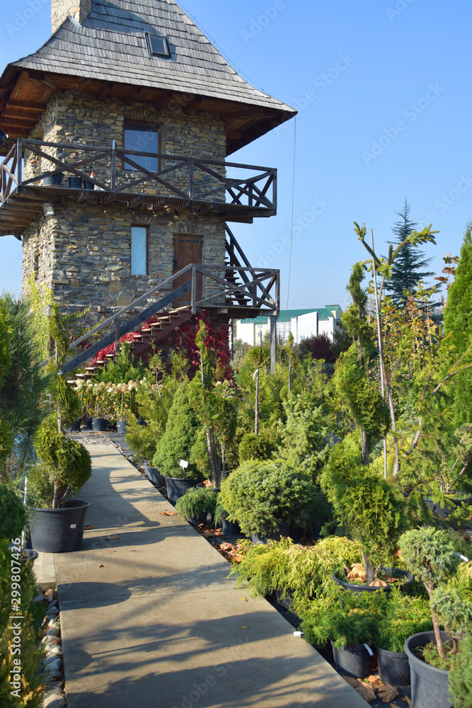 Garden design in rustic country style, Tower house background Garden design in rustic country style, Tower house background