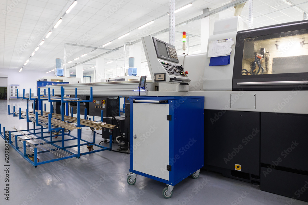 an interior shot of producing line of metal parts in modern plant an interior shot of producing line of metal parts in modern plant