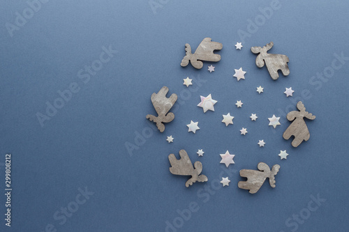 Christmas composition. Reindeer stars top view background with copy space for your text. Flat lay.
