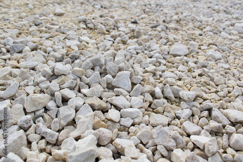 white smooth grey pebbles on beach natural stone background
