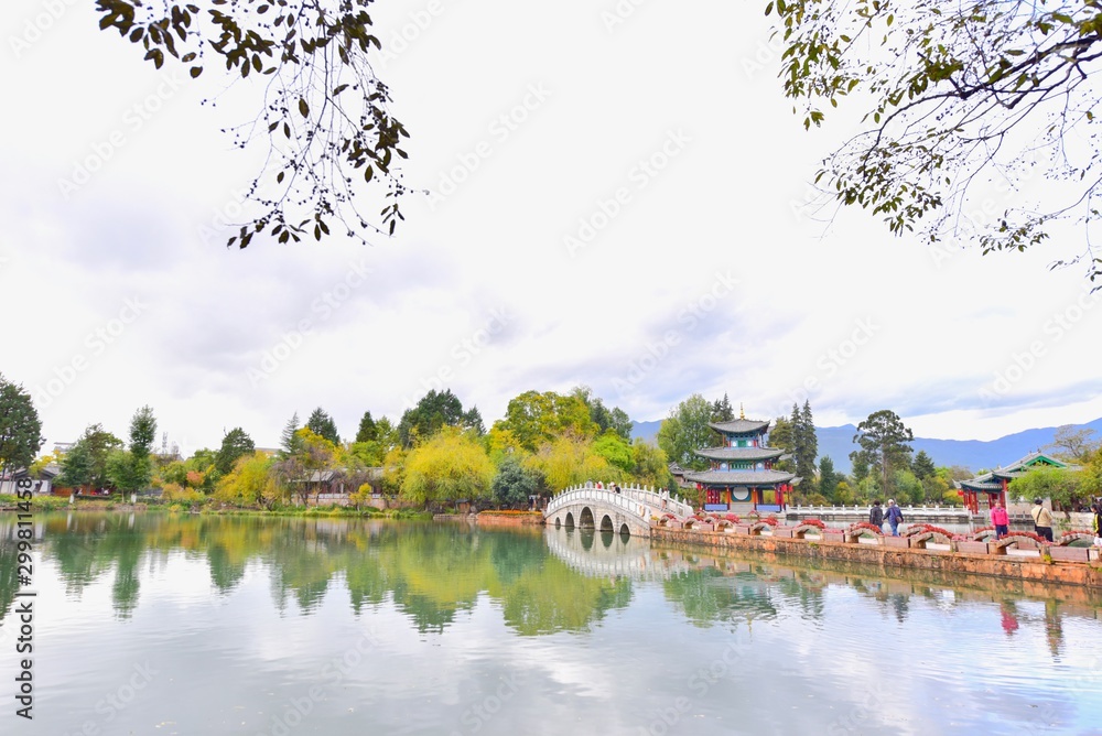 Chinese Pavilion and Ancient Bridge at Black Dragon Pool in Lijiang, China