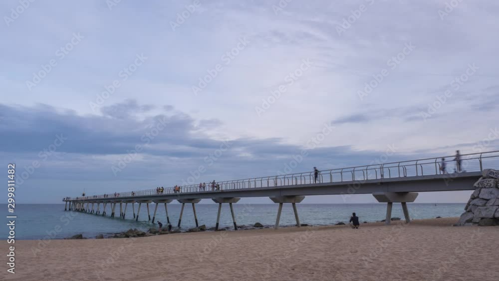 Timelapse of sunset landscape of boardwalk in the beach in Badalona (Barcelona) Timelapse of sunset landscape of boardwalk in the beach in Badalona (Barcelona)
