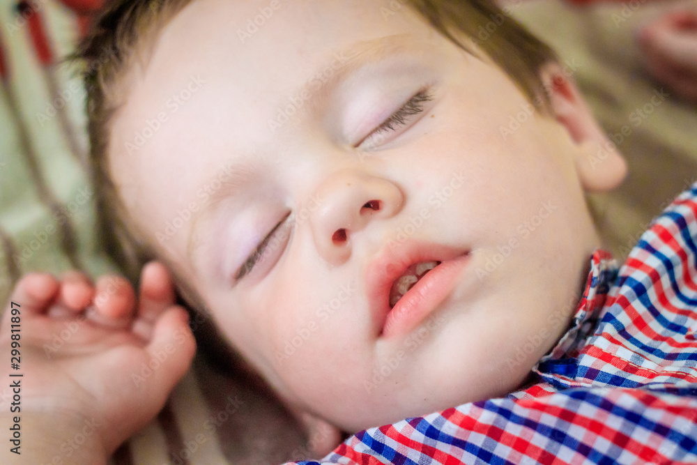 The little boy is asleep . Young child. Sleeping. The little boy is asleep . Young child. Sleeping.