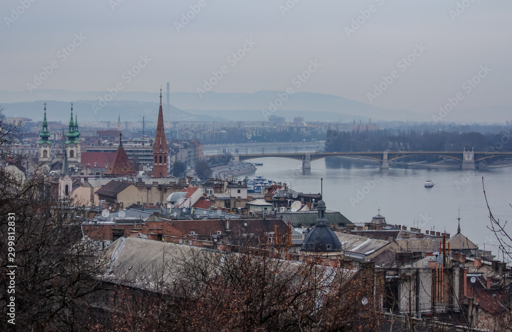 Bridges in Budapest over the Danube River and a building on the waterfront.