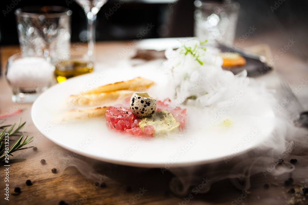 Tuna tartare served on a plate in restaurant