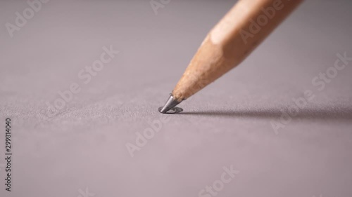 Hand drawing a flat line with a black pencil