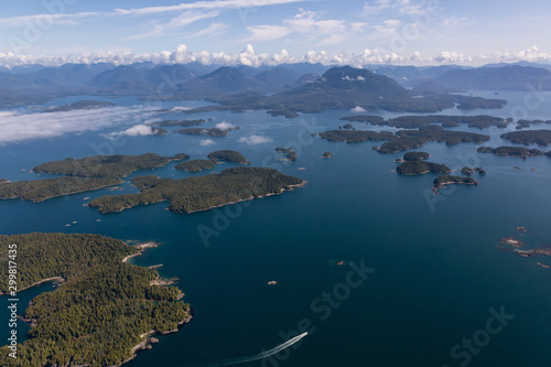 Aerial Landscape View of Beautiful Pacific Ocean Coast with Coastal Mountains at the background during a sunny summer morning. Taken near Tofino and Ucluelet, Vancouver Island, BC, Canada.