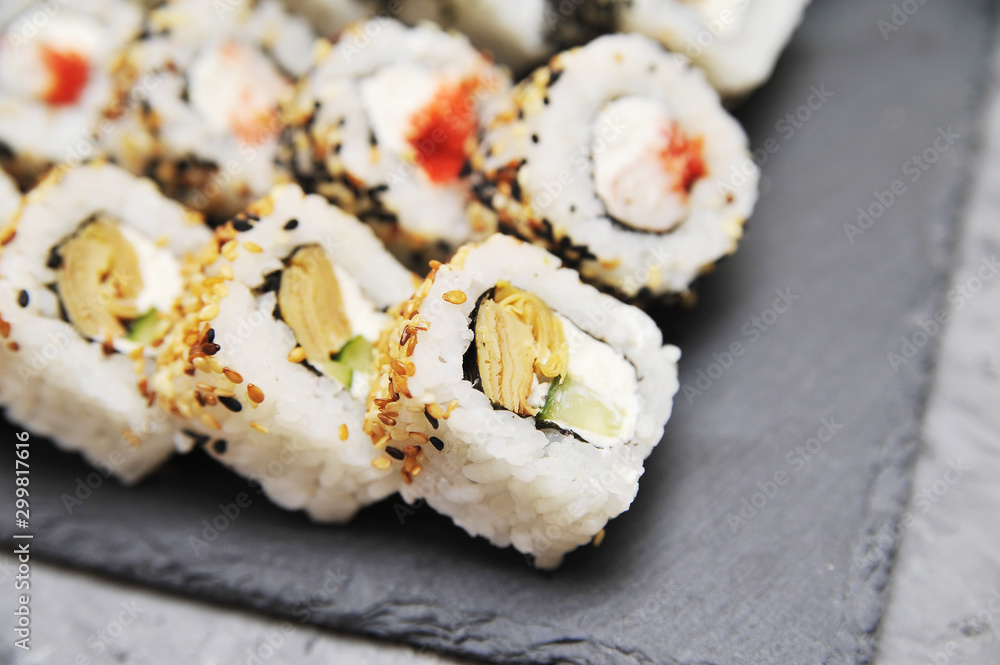 Japanese rolls on stone background. Japanese rolls on stone background.