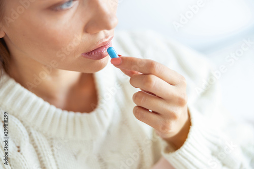 Close up of thoughtful girl that taking medicine