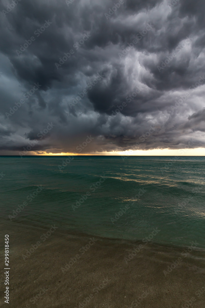 Beautiful view of a sandy beach in Varadero, Cuba, on the Caribbean Sea.  Taken during a dark, thunder and lightening storm.