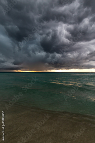 Beautiful view of a sandy beach in Varadero, Cuba, on the Caribbean Sea. Taken during a dark, thunder and lightening storm.