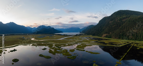 Beautiful Aerial Panoramic View of Canadian Mountain Landscape during a vibrant summer sunset. Taken near Pitt Lake, Near Vancouver, British Columbia, Canada.