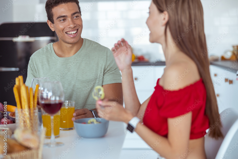 Cheerful man and woman enjoying healthy food