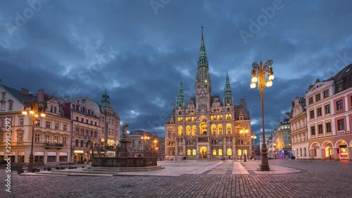 Liberec, Czechia. View of main square with Town Hall building at dusk (static image with animated sky) photo