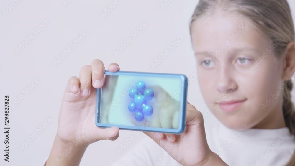 Young girl using futuristic smartphone with holographic virtual mock-up screen technology. Young girl using futuristic smartphone with holographic virtual mock-up screen technology.