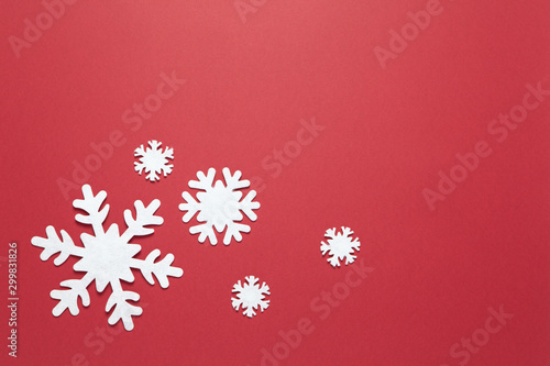 Wallpaper Mural Christmas composition, group of big and small white felt snowflakes on burgundy red background, copy space. Festive, New Year concept. Horizontal, flat lay. Minimal style. Top view Torontodigital.ca