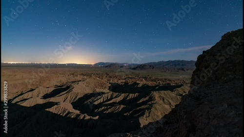 Astro Timelapse Tracking Shot of Moonset behind Font's Point in Anza Borrego photo