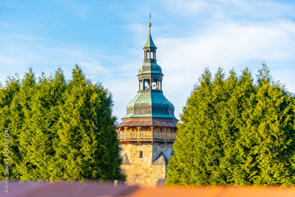 Detailed view of tower of St George Church in Horni Slavkov. Sunny autumn day. Czech Republic Detailed view of tower of St George Church in Horni Slavkov. Sunny autumn day. Czech Republic