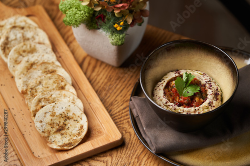 Baba ganoush hummus with eggplant on wooden table background.