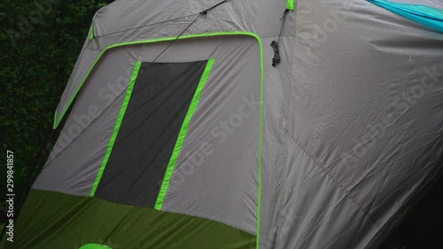 Cinematic view of the hevy rain on Camping tent photo