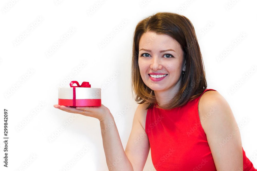 Young beautiful woman, lady in red holiday clothes with snowy smile holding a gift box. holiday concept. girl give and receive gifts. copy space, banner, postcard, layout, isolate on white. Young beautiful woman, lady in red holiday clothes with snowy smile holding a gift box. holiday concept. girl give and receive gifts. copy space, banner, postcard, layout, isolate on white.