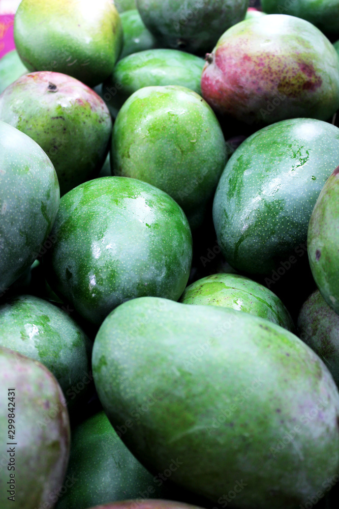 Fresh, green mangoes on the market. Fresh, green mangoes on the market.