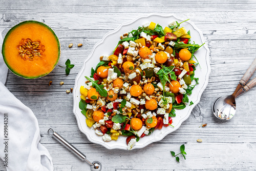 Directly above shot of fresh salad in plate on wooden table