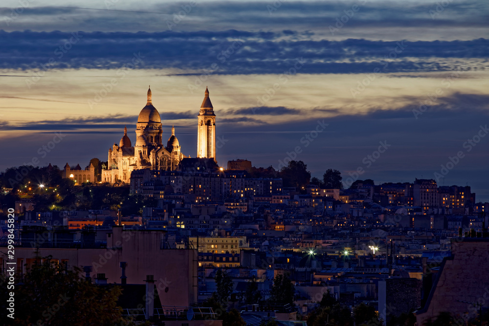 Paris, France - October 26, 2019: Sacre coeur basilica at the summit of Montmartre from Bergeyre hill, Paris