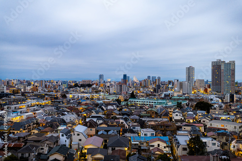 Photography Shinjuku cityscape in Tokyo, Japan at dark stormy night with apartment buildings