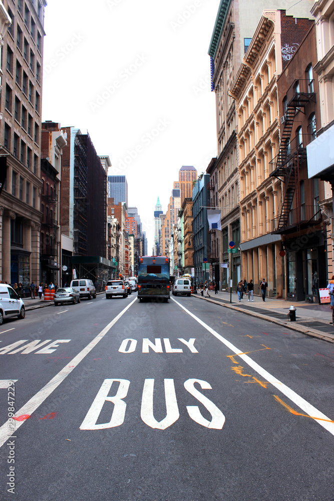 New York, New York, USA October 6, 2016 View of the road and a departing bus, Soho in Manhattan. New York, New York, USA October 6, 2016 View of the road and a departing bus, Soho in Manhattan.