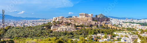 Panorama of Athens with Acropolis hill, Greece. Famous old Acropolis is a top landmark of Athens. Landscape of the Athens city with classical Greek ruins. Scenic view of remains of ancient Athens. photo