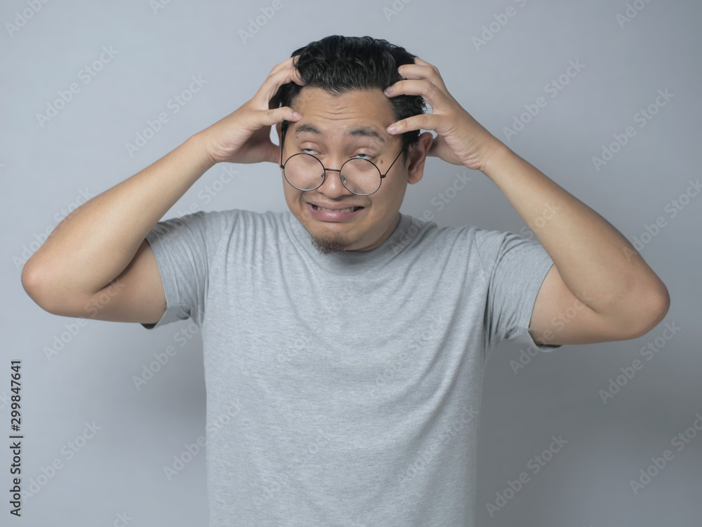 Young Man Frustrated, headache, stress and dizzy gesture Young Man Frustrated, headache, stress and dizzy gesture